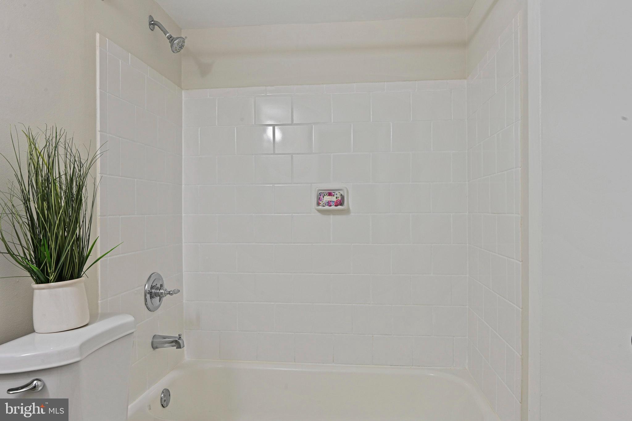 11625 Vantage Hill Road, Unit C Reston, VA 20190 - Photo 15 of 35 a bathroom with a bathtub a toilet and a shower