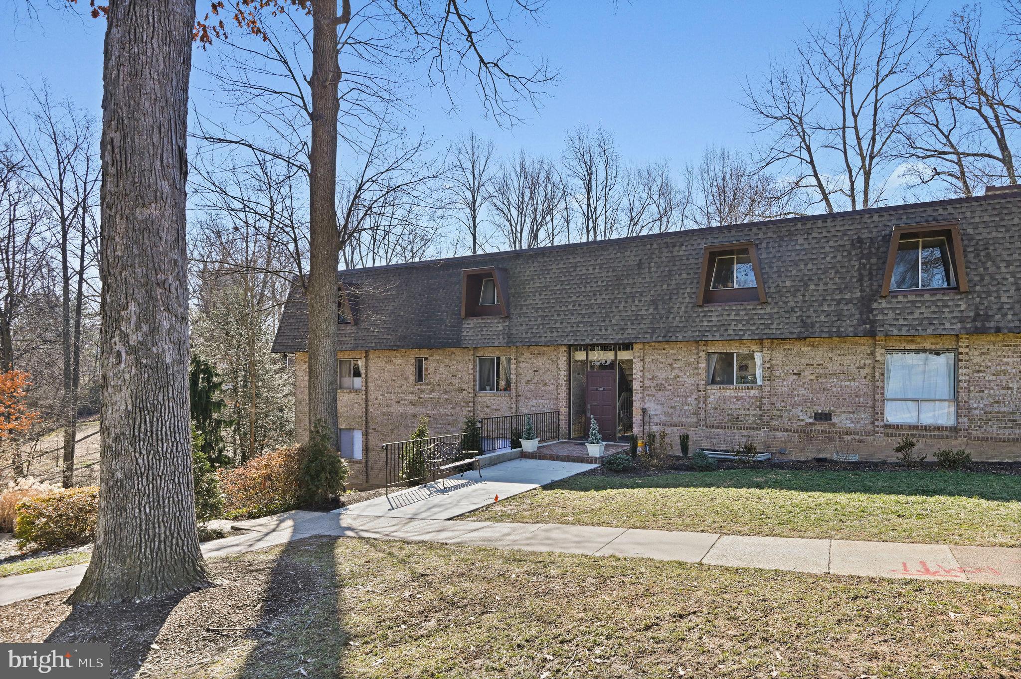 11625 Vantage Hill Road, Unit C Reston, VA 20190 - Photo 2 of 35 a front view of a house with a yard