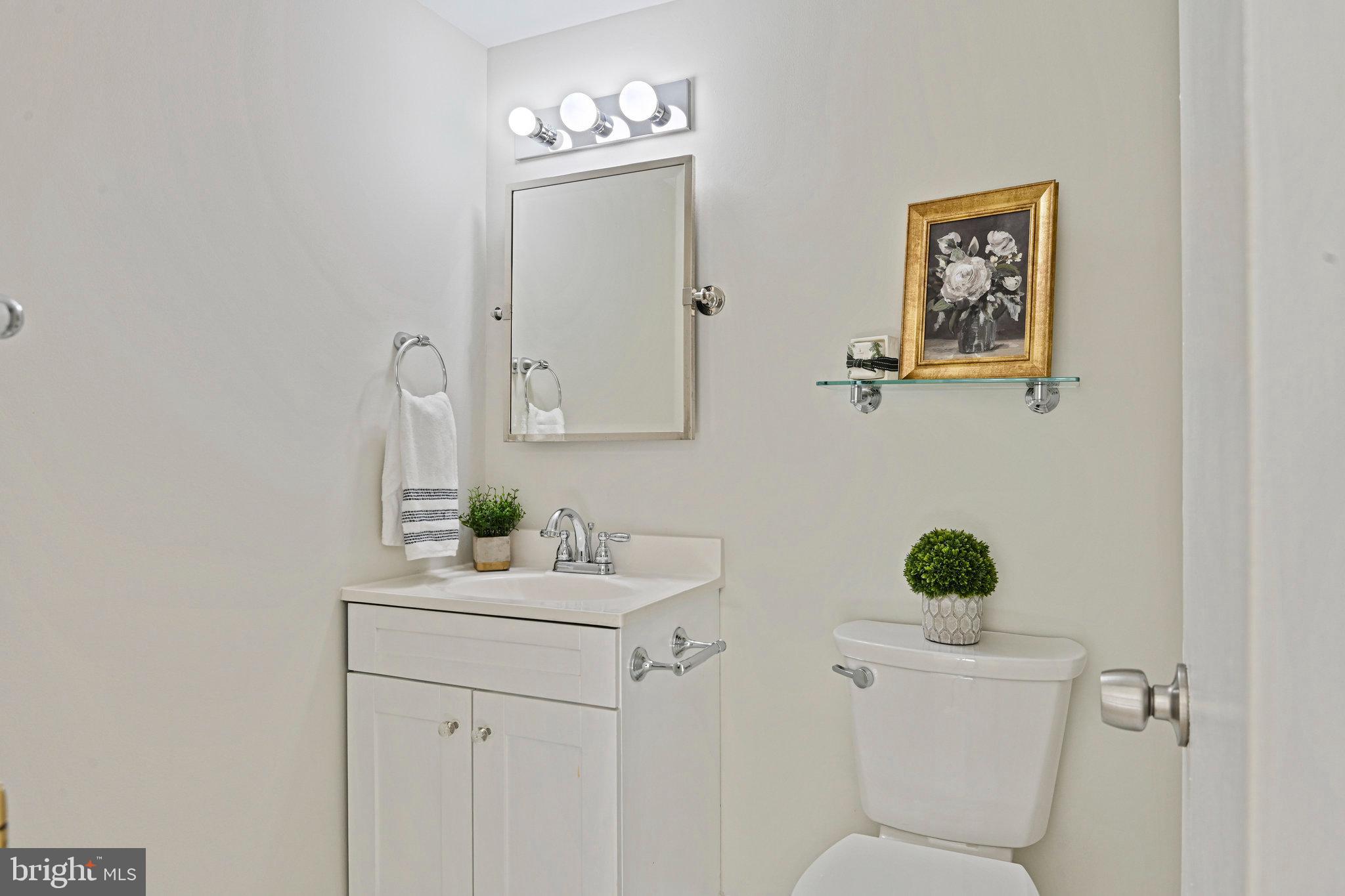 11625 Vantage Hill Road, Unit C Reston, VA 20190 - Photo 27 of 35 a bathroom with a toilet sink and mirror