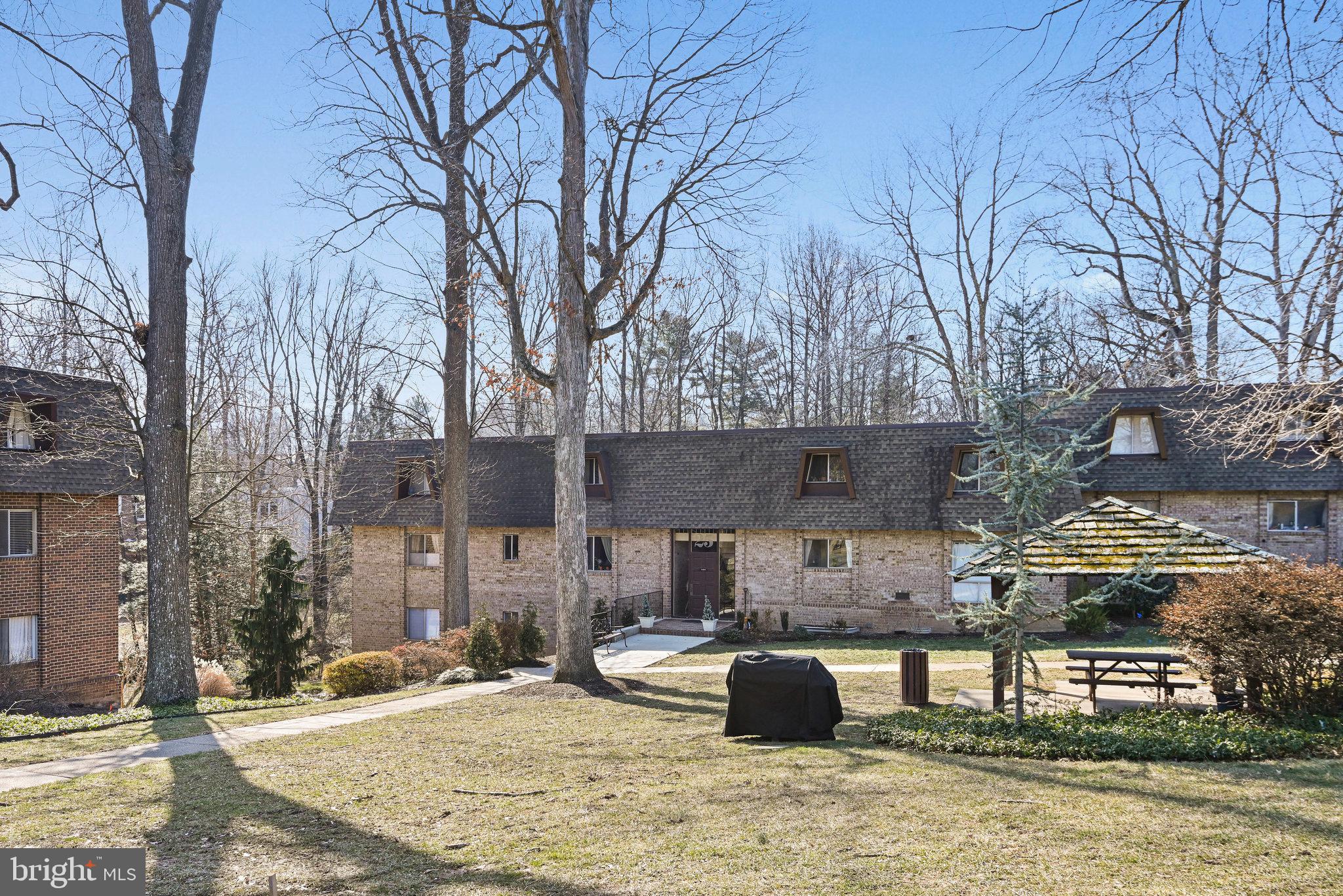 11625 Vantage Hill Road, Unit C Reston, VA 20190 - Photo 3 of 35 a view of a house with snow on tree