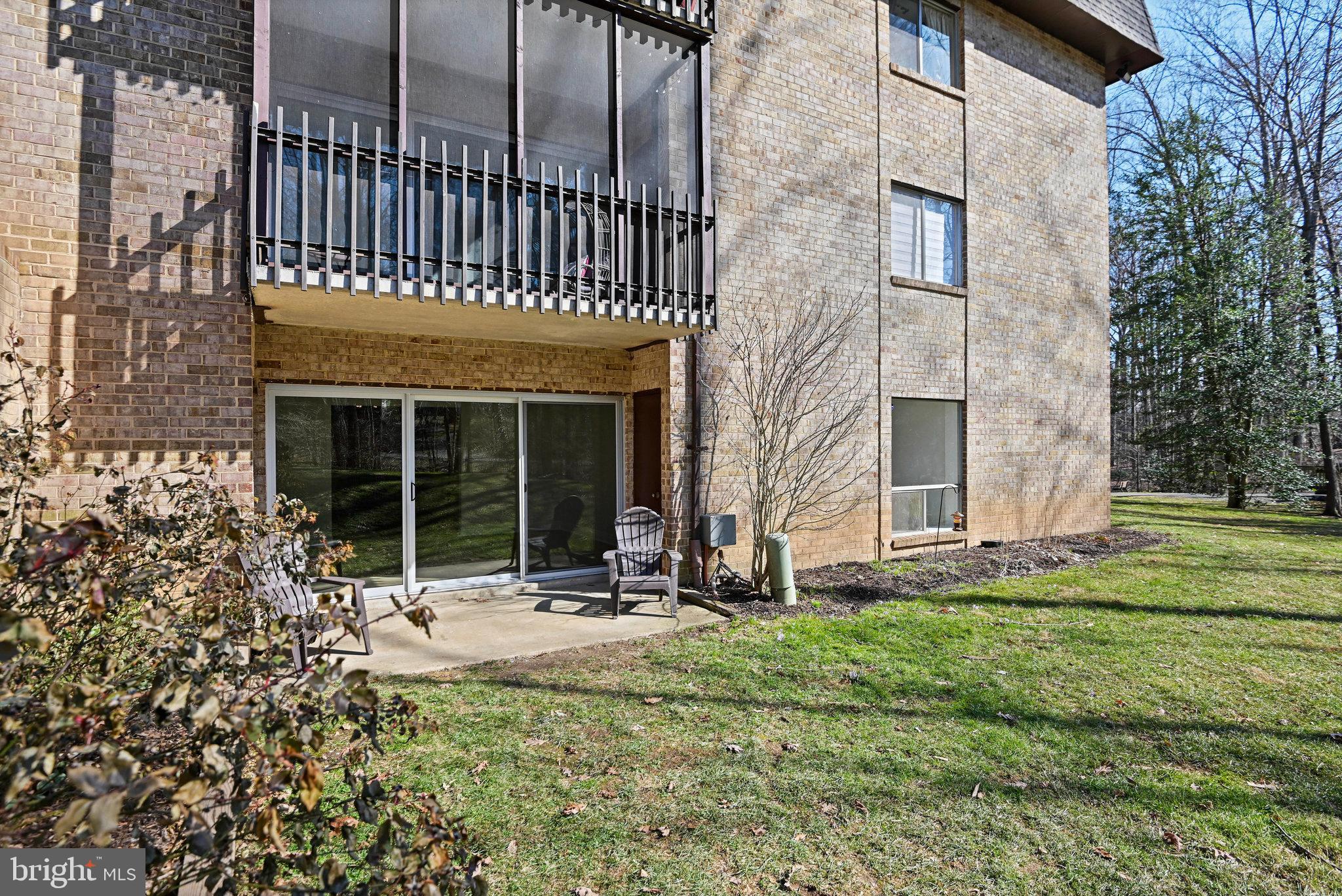 11625 Vantage Hill Road, Unit C Reston, VA 20190 - Photo 31 of 35 a view of a house with a yard and sitting area