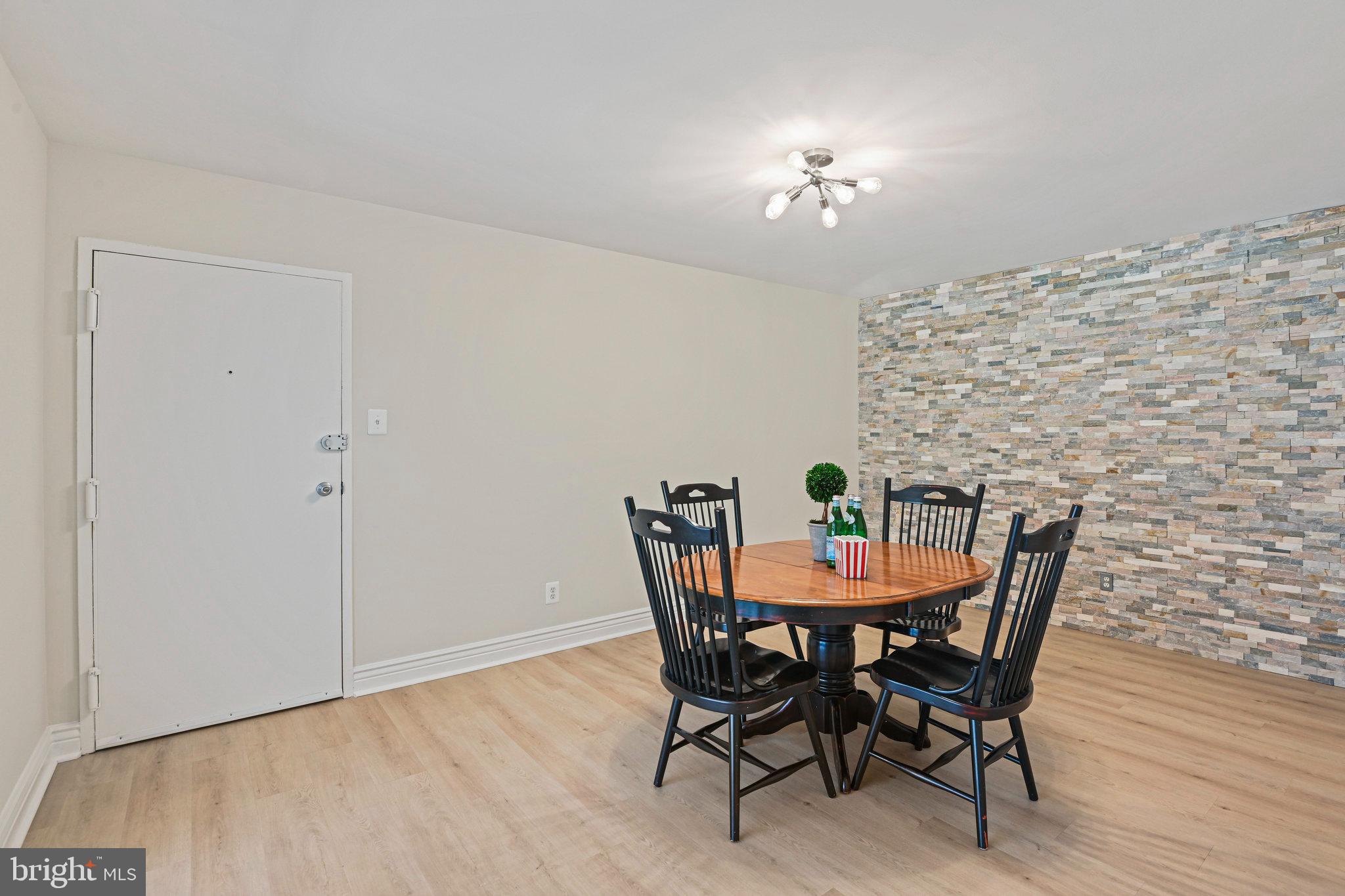 11625 Vantage Hill Road, Unit C Reston, VA 20190 - Photo 4 of 35 a dining room with furniture and chandelier