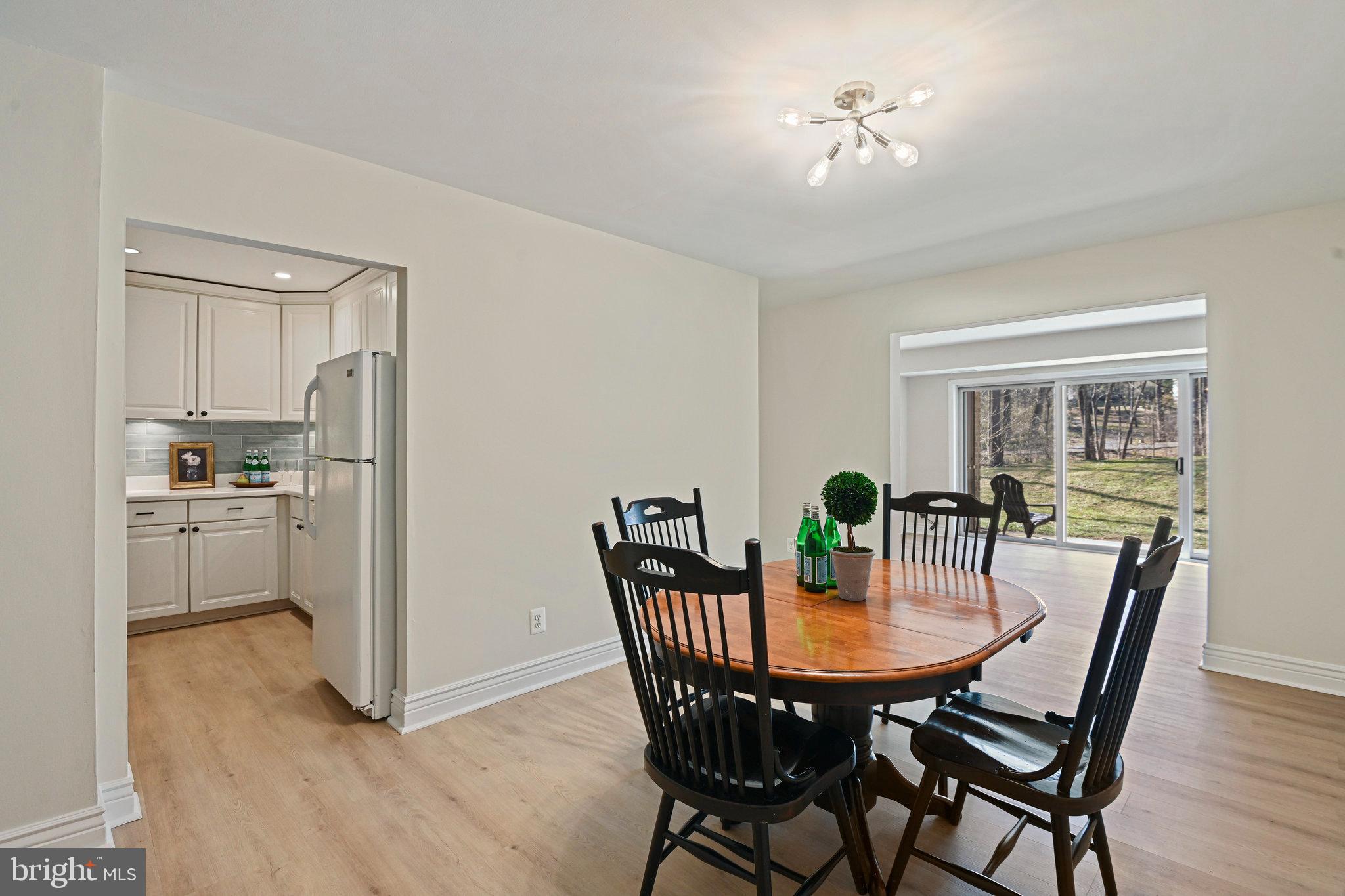 11625 Vantage Hill Road, Unit C Reston, VA 20190 - Photo 5 of 35 a view of a dining room with furniture and wooden floor
