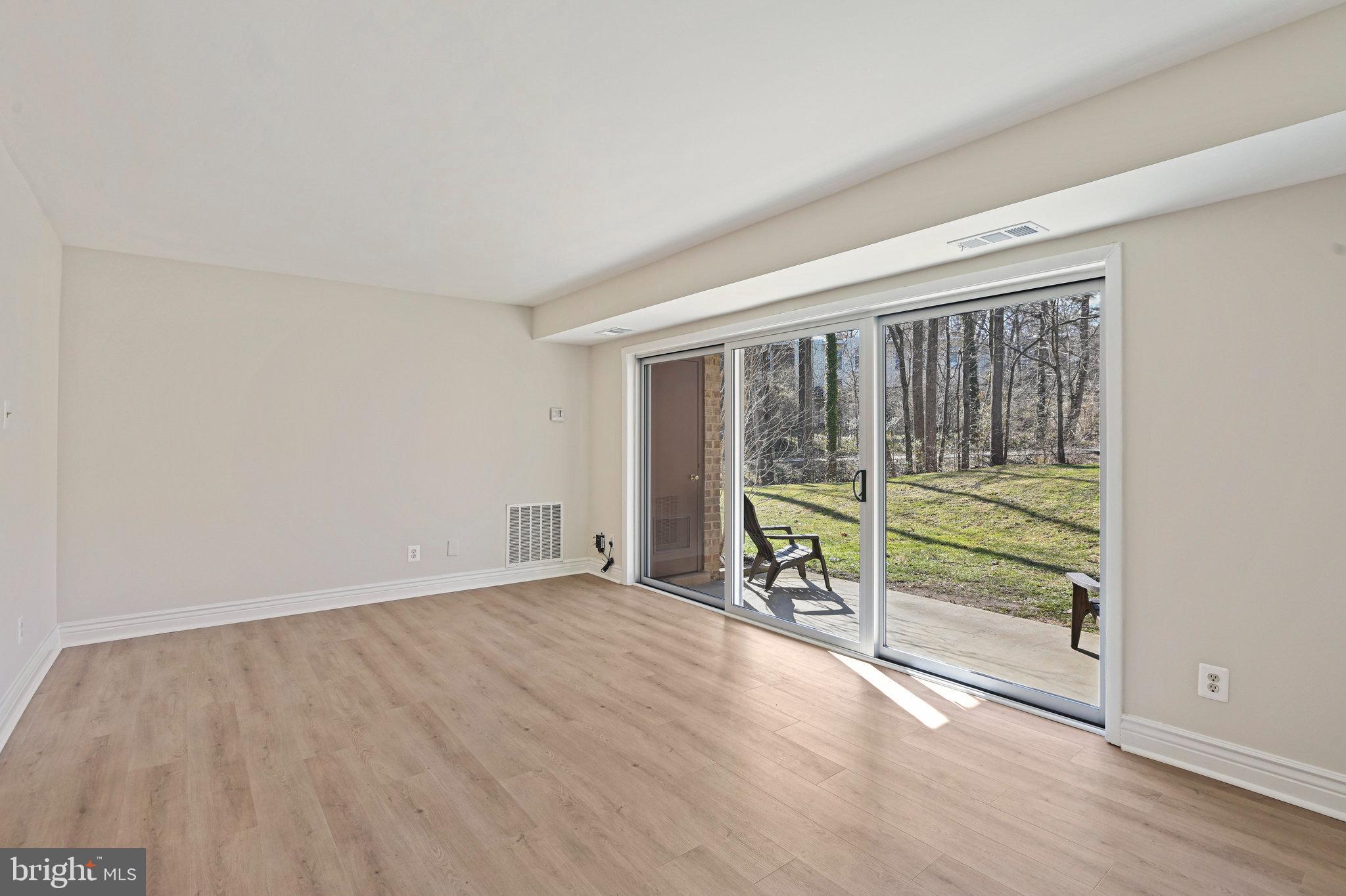 11625 Vantage Hill Road, Unit C Reston, VA 20190 - Photo 7 of 35 wooden floor in an empty room with a window