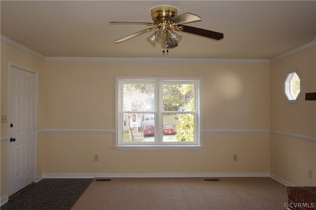 3237 Fielding Road Colonial Heights, VA 23834 - Photo 6 of 21 an empty room with a window and a fan