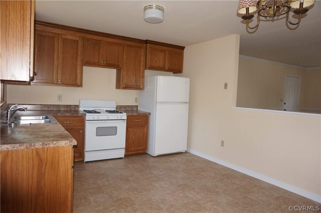 3237 Fielding Road Colonial Heights, VA 23834 - Photo 7 of 21 a kitchen with white cabinets and white appliances
