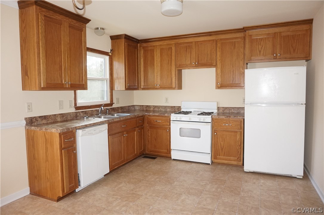 3237 Fielding Road Colonial Heights, VA 23834 - Photo 8 of 21 a kitchen with white cabinets and white appliances