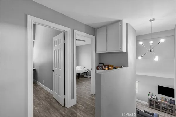 a kitchen with a refrigerator and a stove top oven