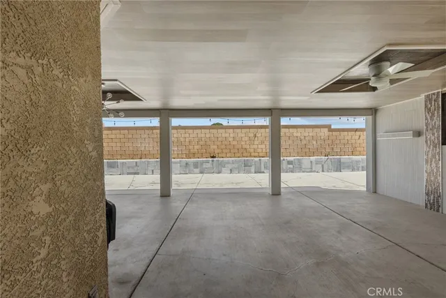 a view of an empty room and a window