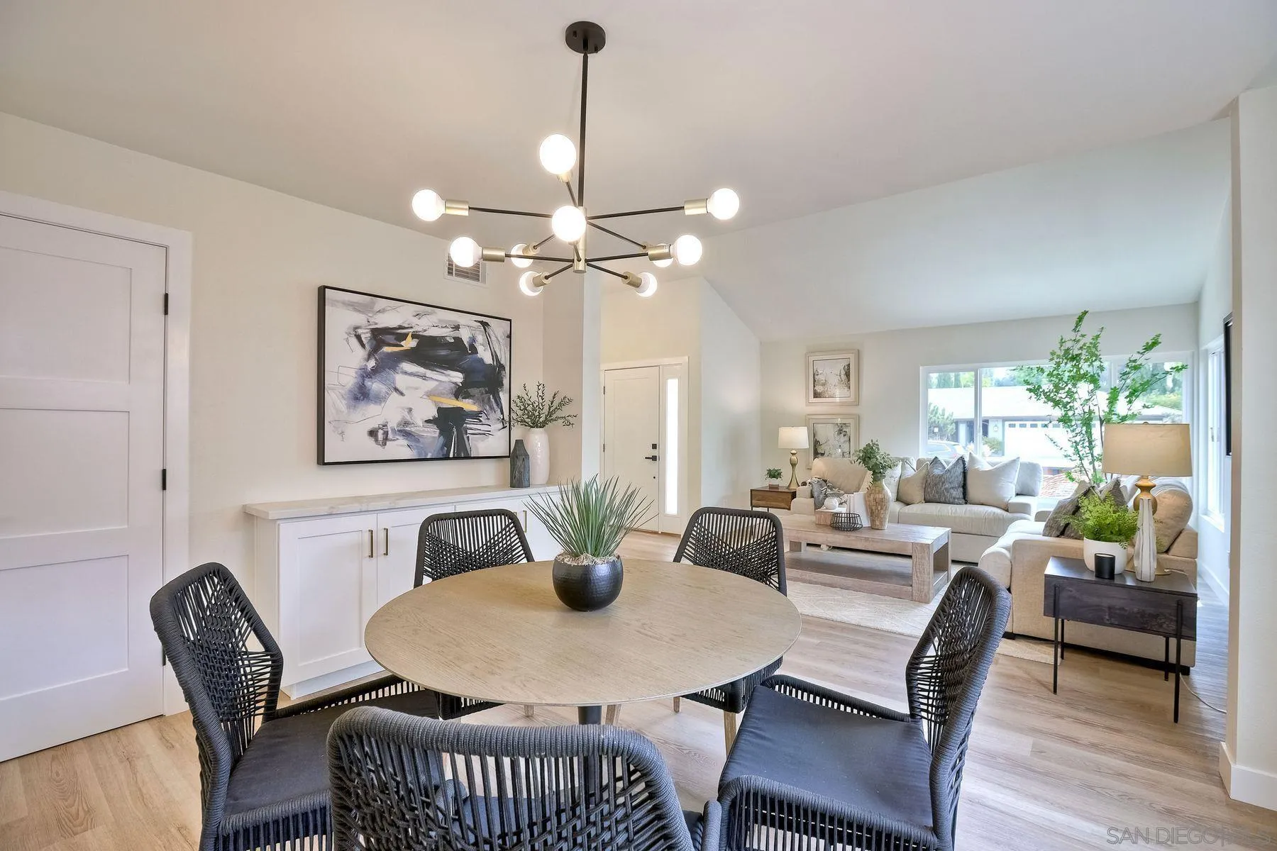 3577 Winslow Road Oceanside, CA 92056 - Photo 12 of 42 a view of a dining room with furniture a chandelier and wooden floor