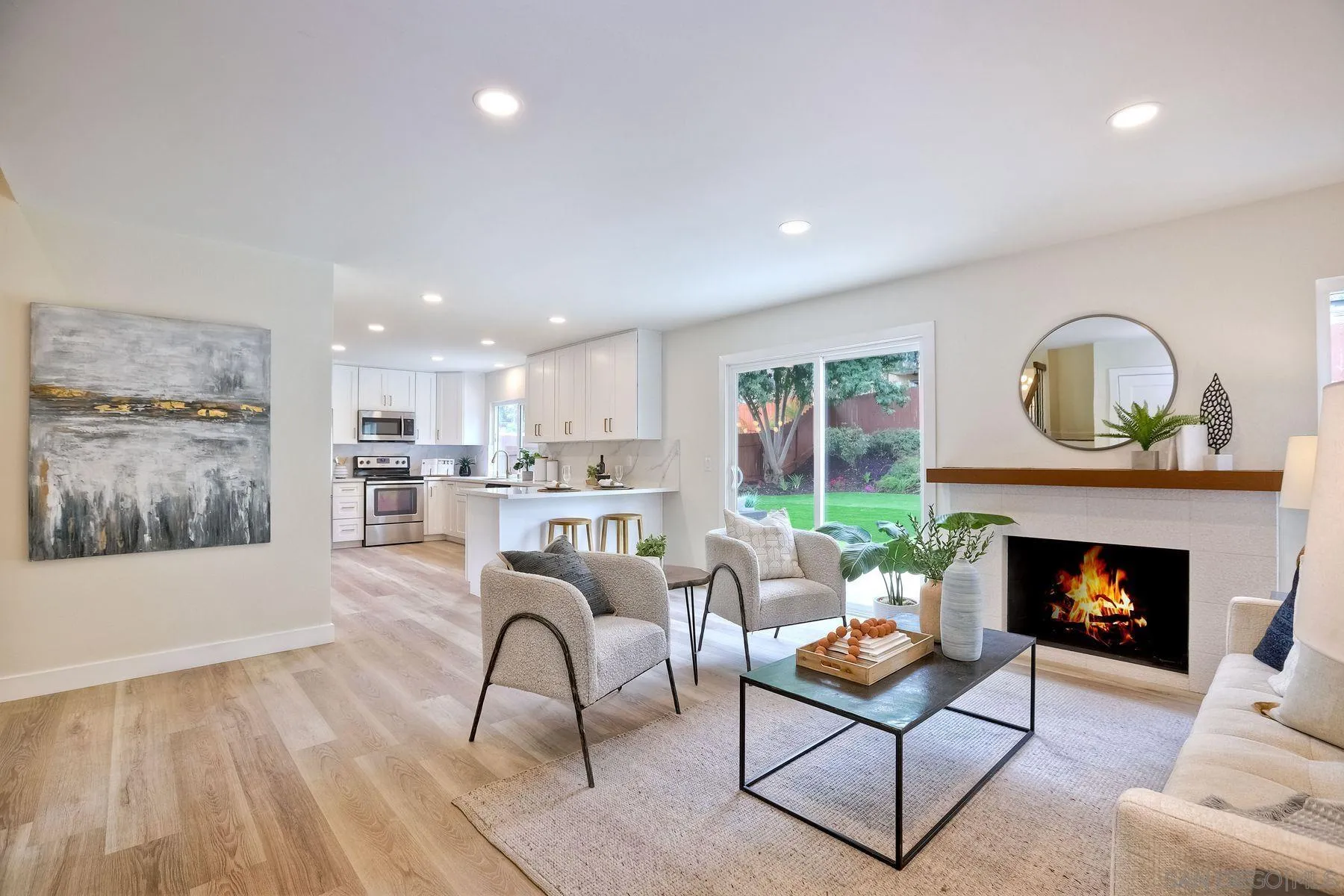 3577 Winslow Road Oceanside, CA 92056 - Photo 22 of 42 a living room with furniture and a fireplace