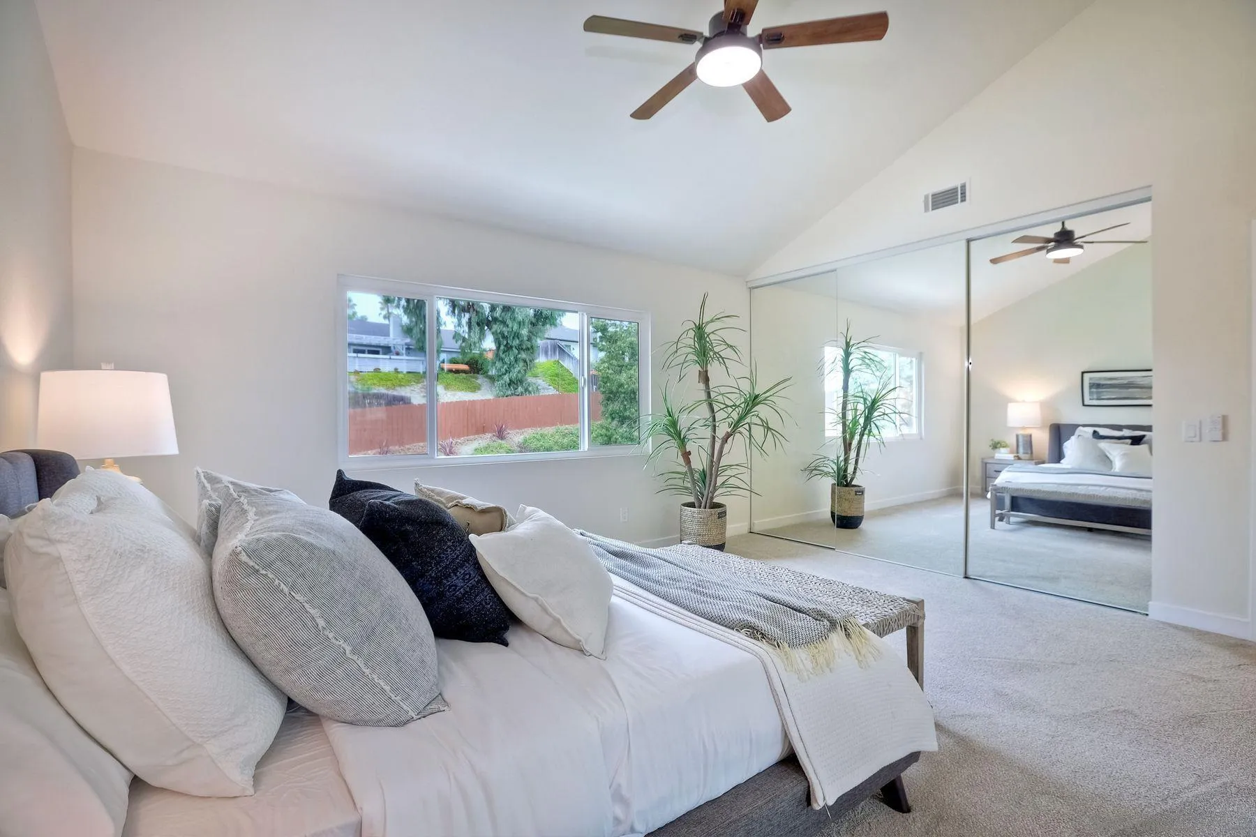 3577 Winslow Road Oceanside, CA 92056 - Photo 27 of 42 a bedroom with a bed and a large window