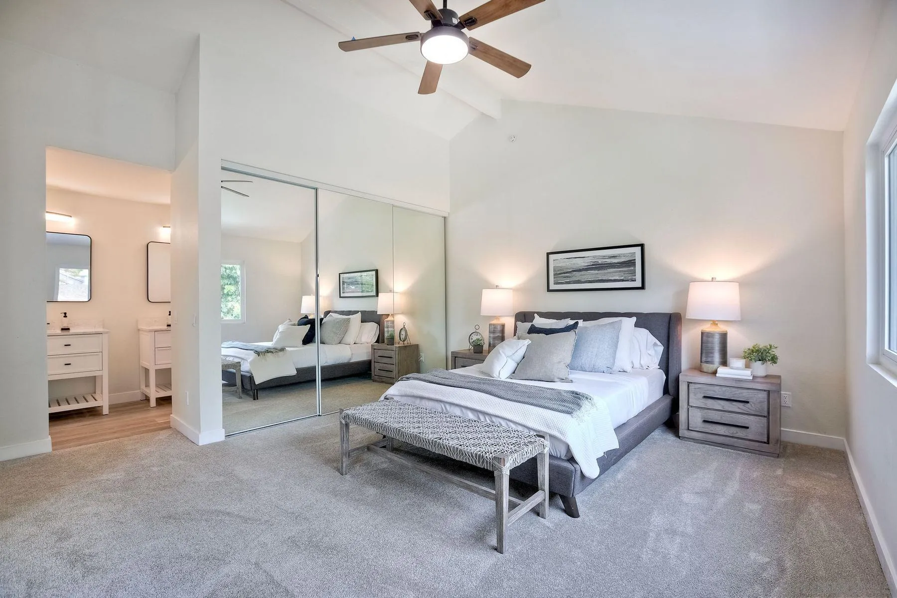 3577 Winslow Road Oceanside, CA 92056 - Photo 28 of 42 a spacious bedroom with a bed and a chandelier