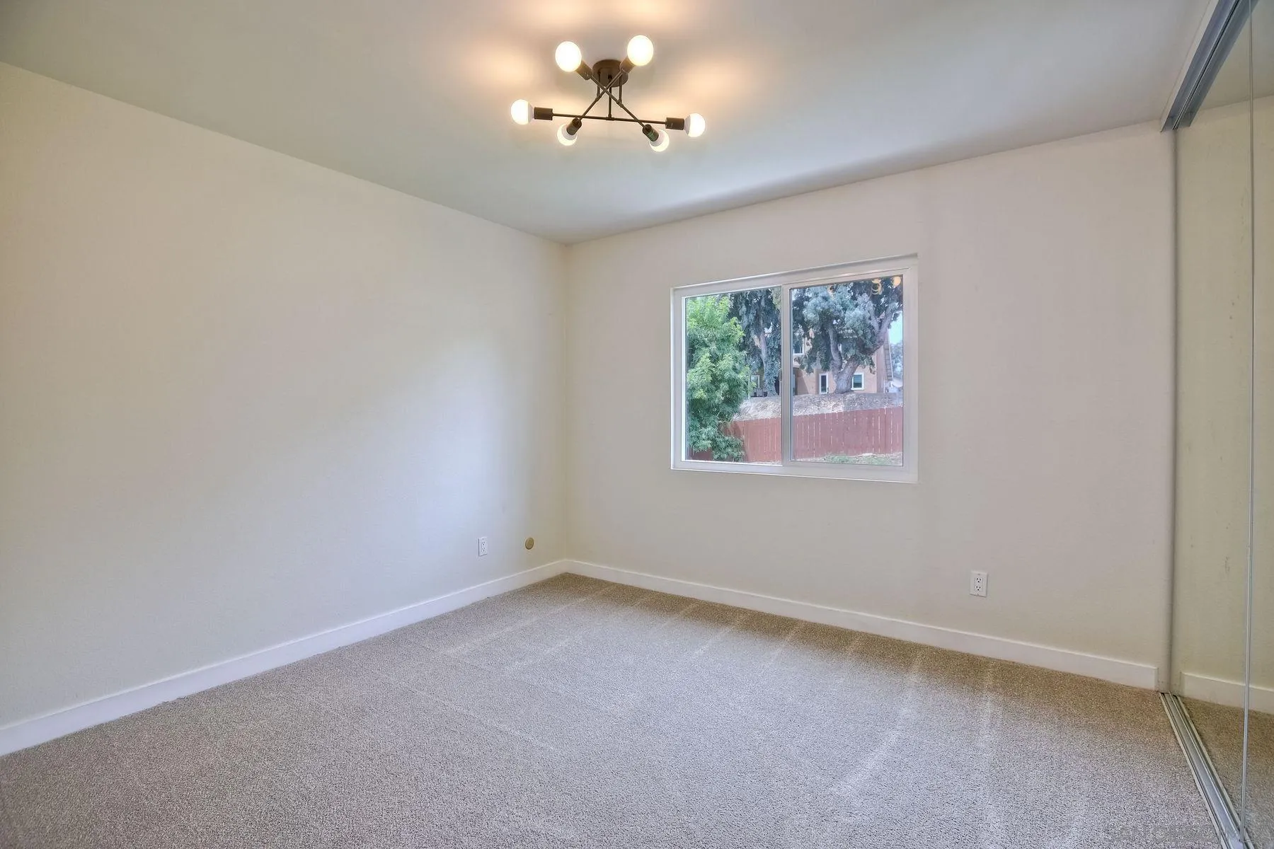 3577 Winslow Road Oceanside, CA 92056 - Photo 30 of 42 wooden floor in an empty room with a window