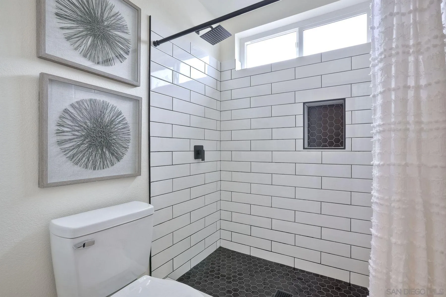 3577 Winslow Road Oceanside, CA 92056 - Photo 34 of 42 a bathroom with a toilet and a shower