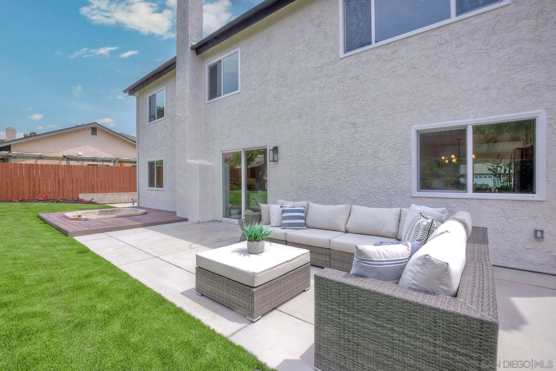 3577 Winslow Road Oceanside, CA 92056 - Photo 35 of 42 a view of a patio with couches and a table and chairs with garden view