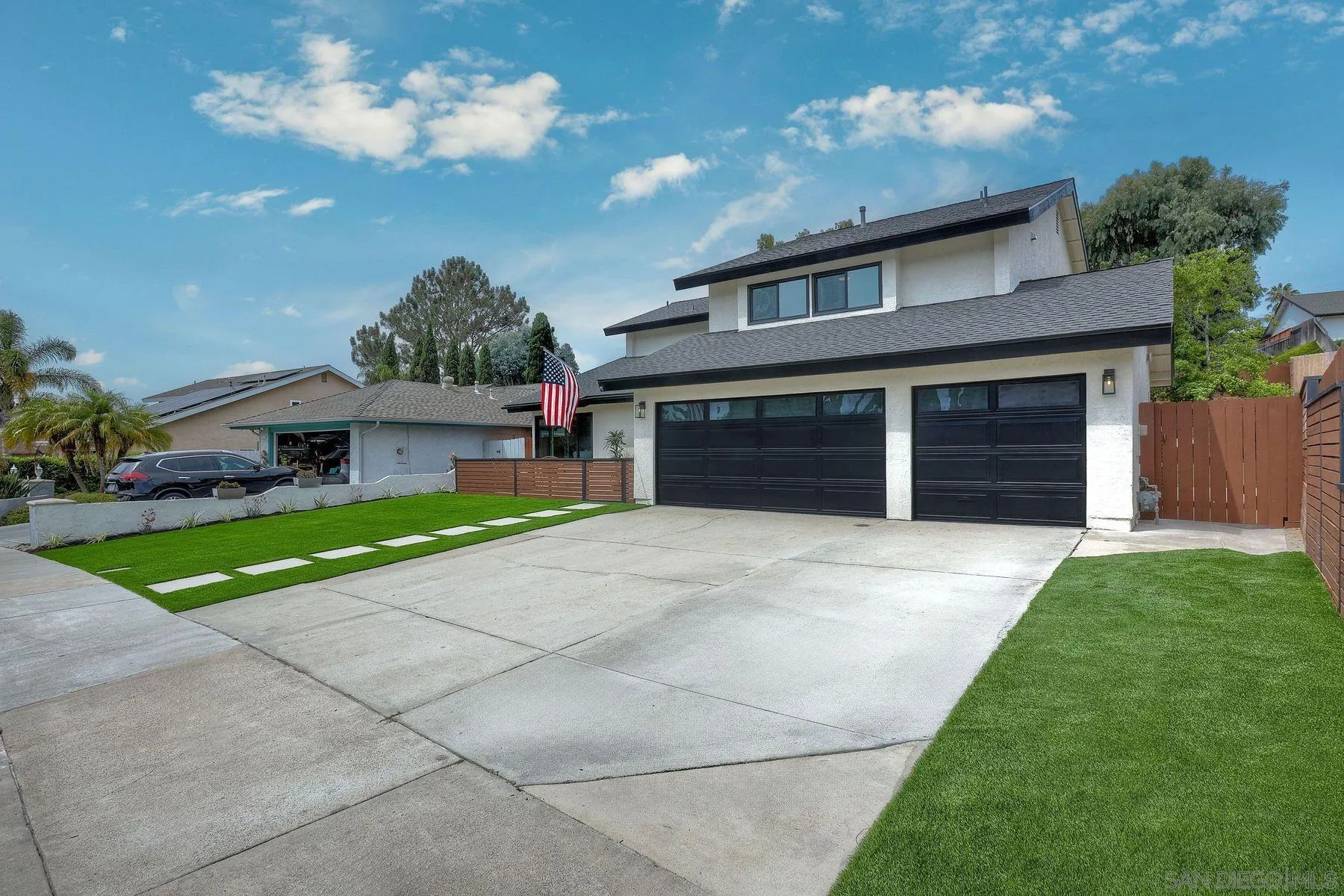 3577 Winslow Road Oceanside, CA 92056 - Photo 5 of 42 a front view of a house with a yard and garage