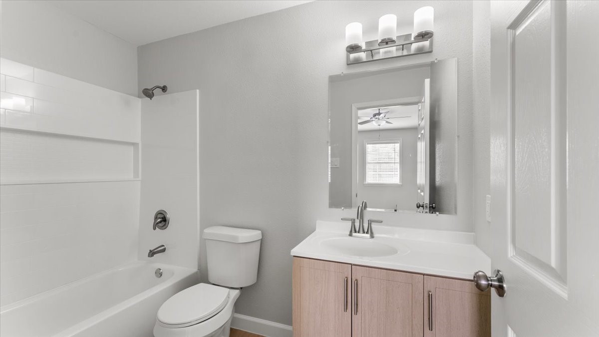 3123 Patience Avenue Houston, TX 77014 - Photo 16 of 22 a bathroom with a sink a toilet and shower