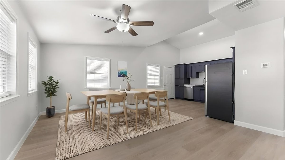 3123 Patience Avenue Houston, TX 77014 - Photo 3 of 22 a view of a dining room with furniture window and wooden floor
