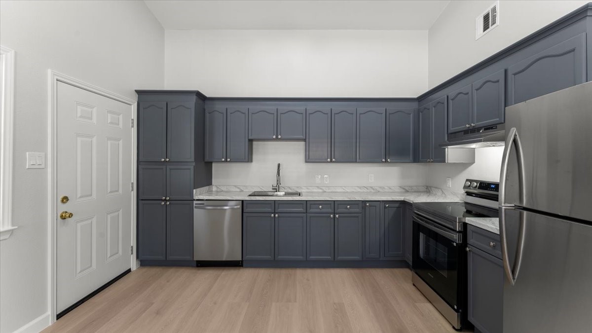 3123 Patience Avenue Houston, TX 77014 - Photo 7 of 22 a kitchen with stainless steel appliances granite countertop a refrigerator and a stove