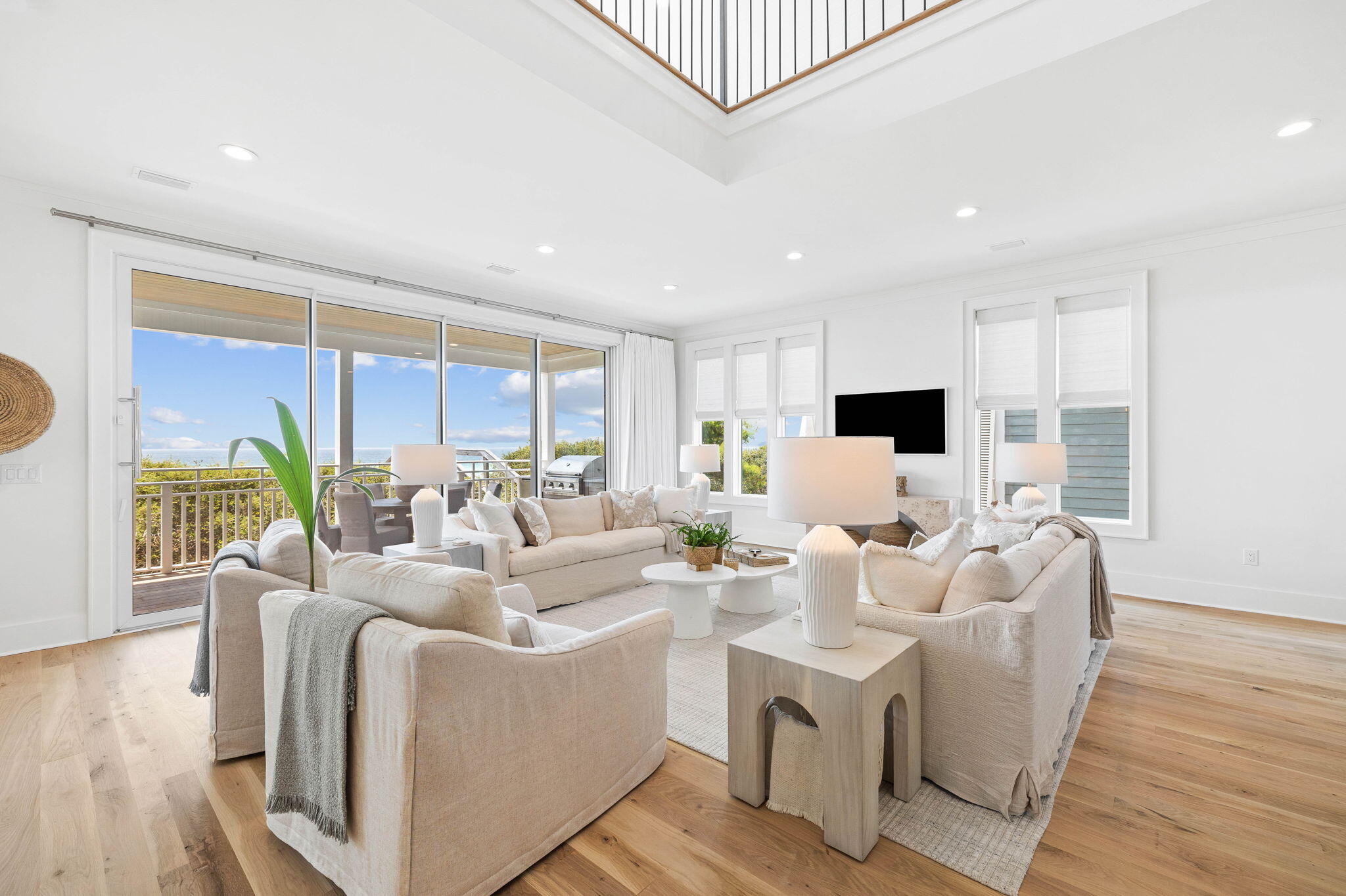 357 Old Beach Road Santa Rosa Beach, FL 32459 - Photo 19 of 106 a living room with furniture a large window and a wooden floor