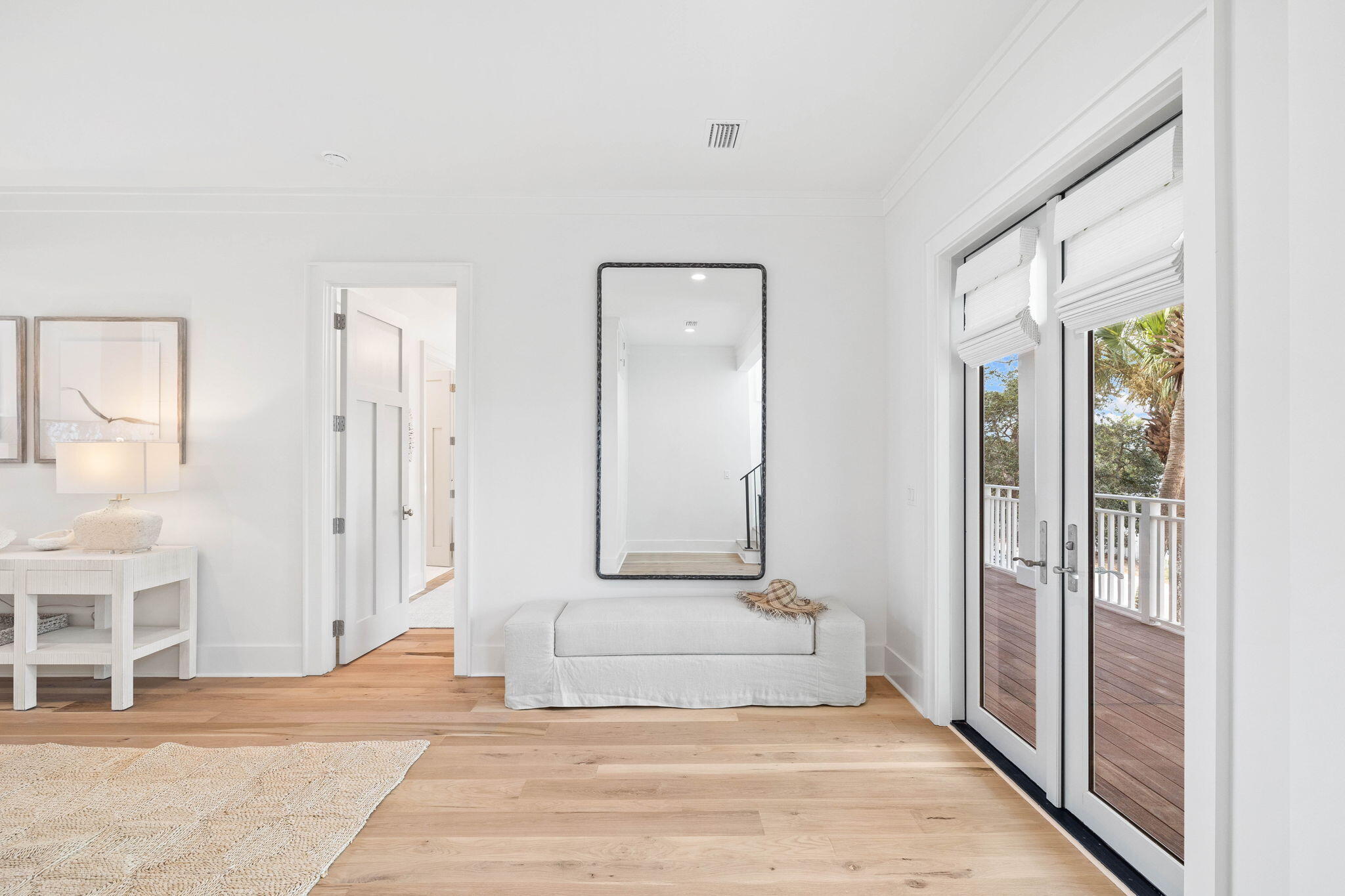 357 Old Beach Road Santa Rosa Beach, FL 32459 - Photo 32 of 106 a view of a hallway with wooden floor and a living room