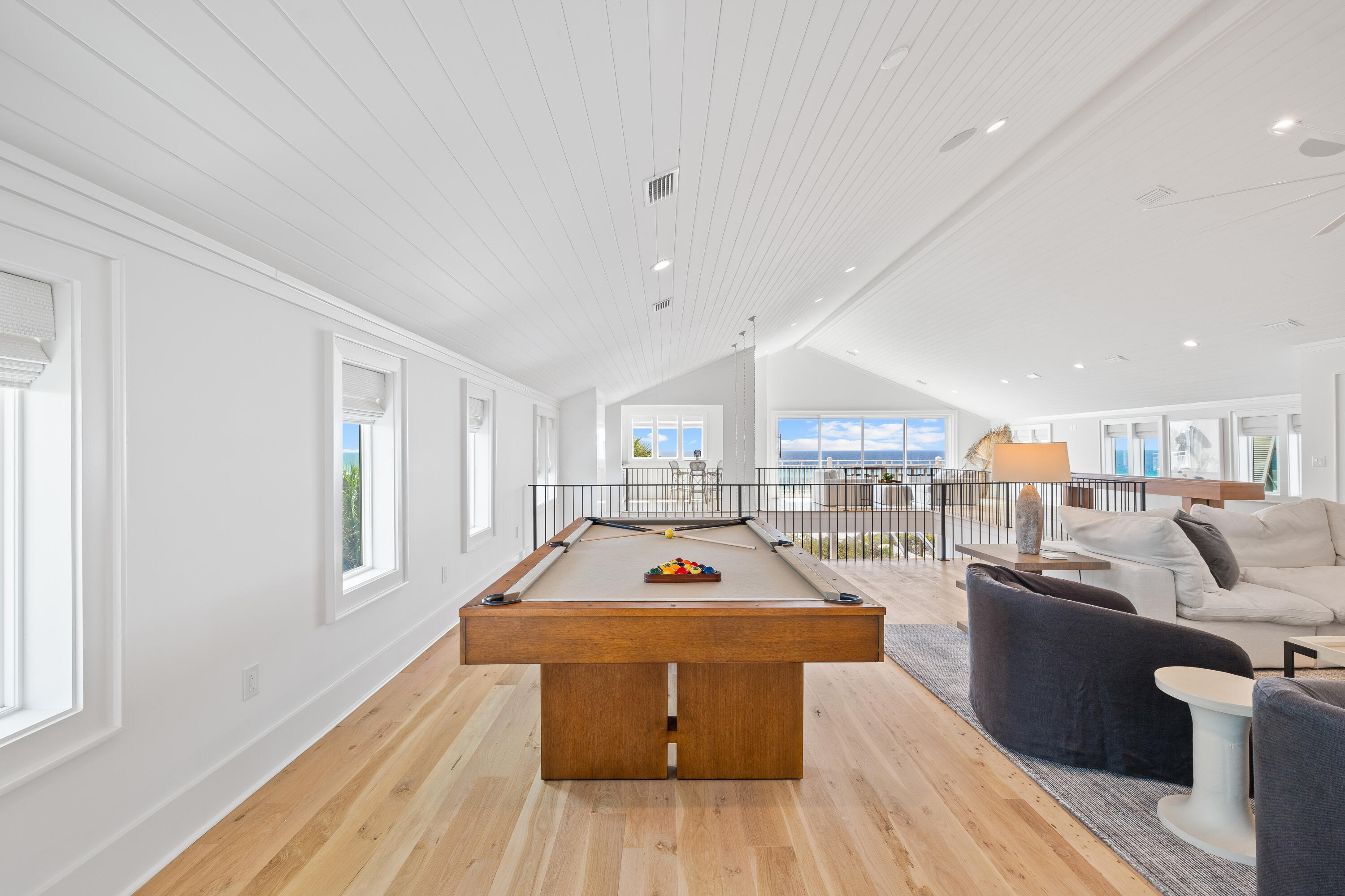 357 Old Beach Road Santa Rosa Beach, FL 32459 - Photo 42 of 106 a living room with furniture a flat screen tv and a table