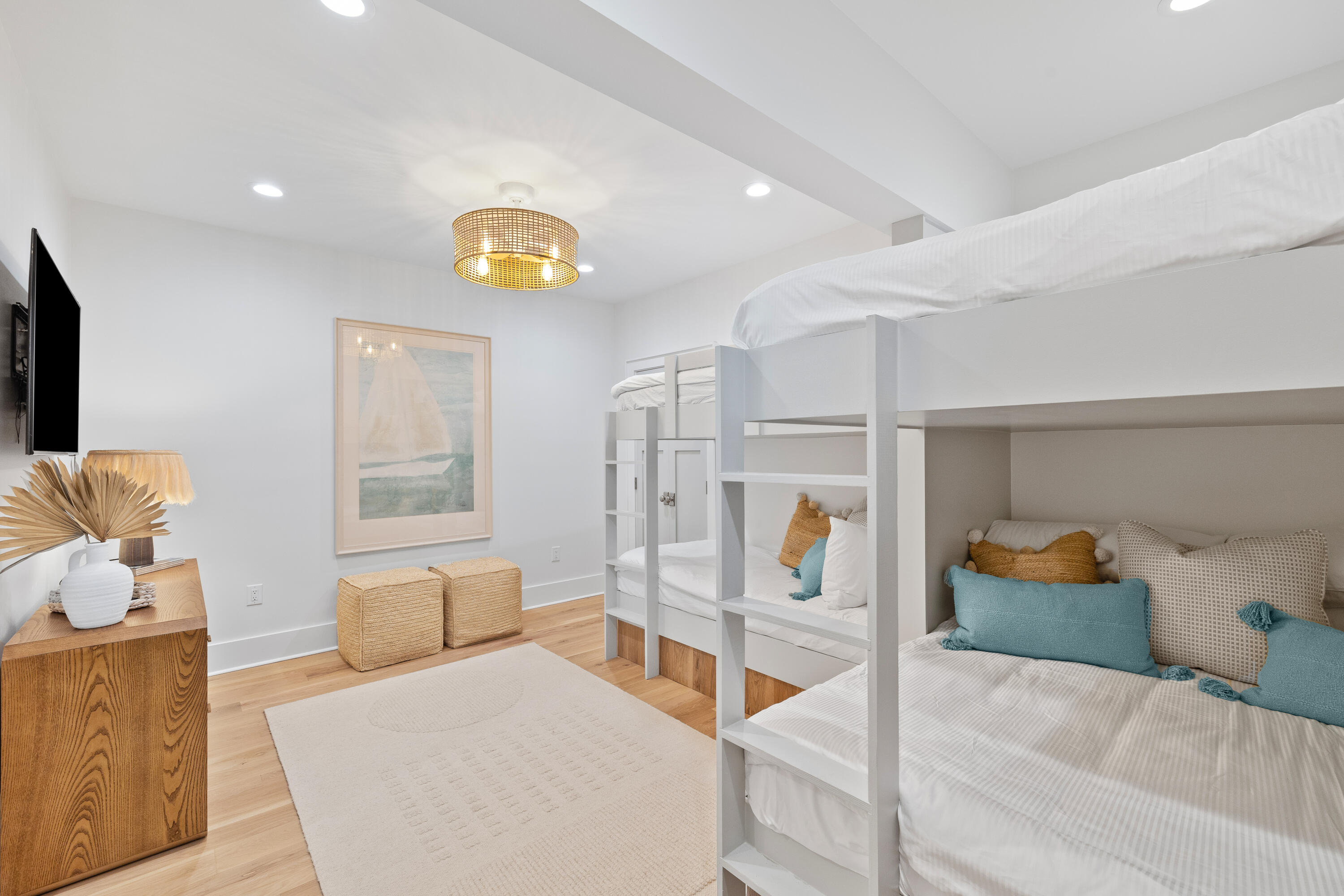 357 Old Beach Road Santa Rosa Beach, FL 32459 - Photo 69 of 106 a bedroom with furniture and a lamp