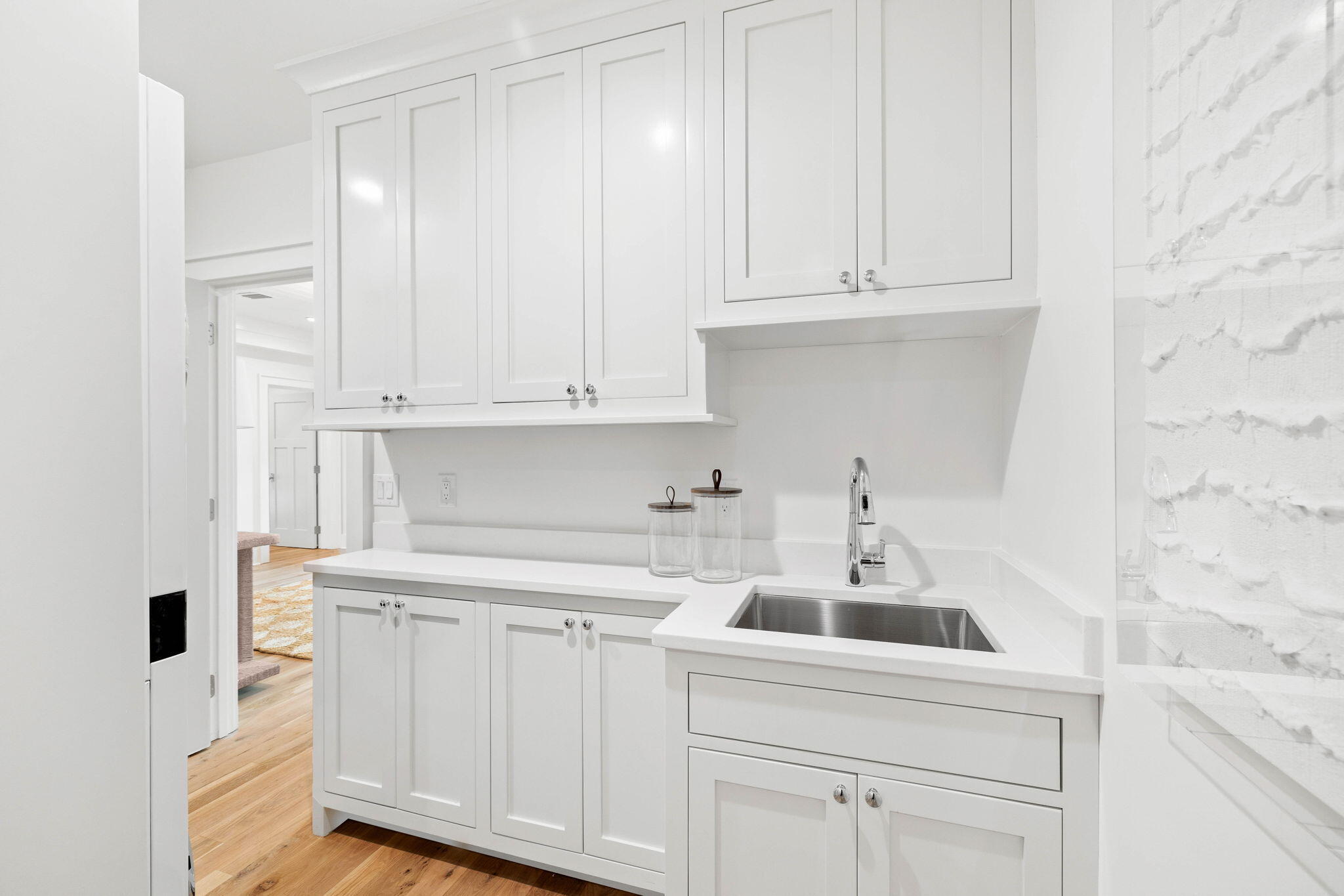 357 Old Beach Road Santa Rosa Beach, FL 32459 - Photo 75 of 106 a kitchen with white cabinets and sink