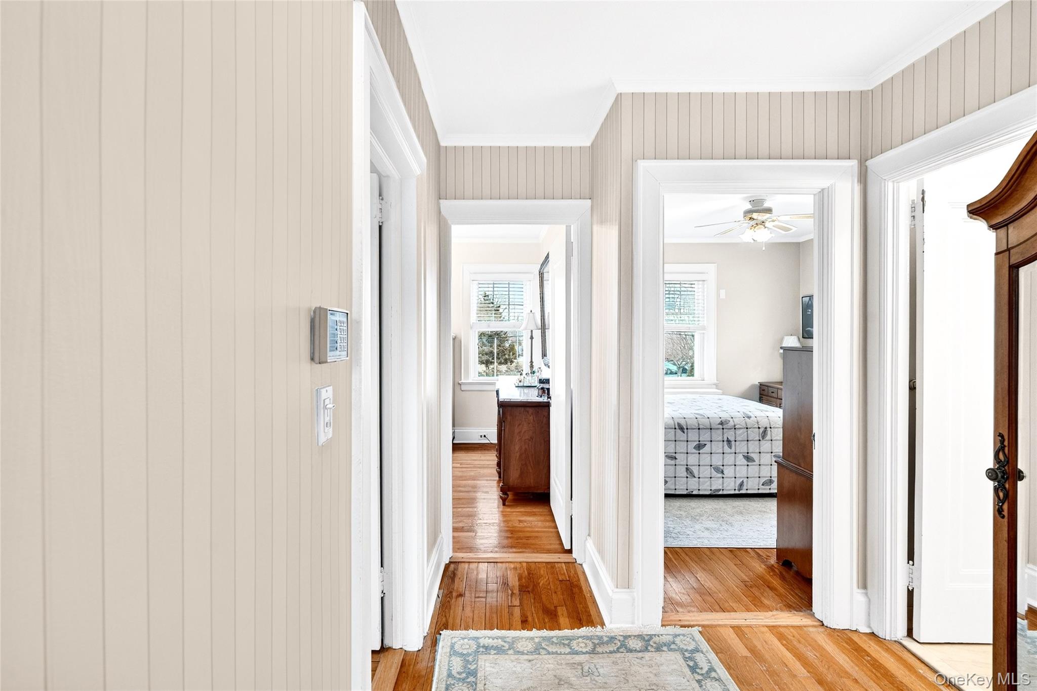 3334 Country Club Road Bronx, NY 10465 - Photo 30 of 49 Hallway with light wood-type flooring and ornamental molding