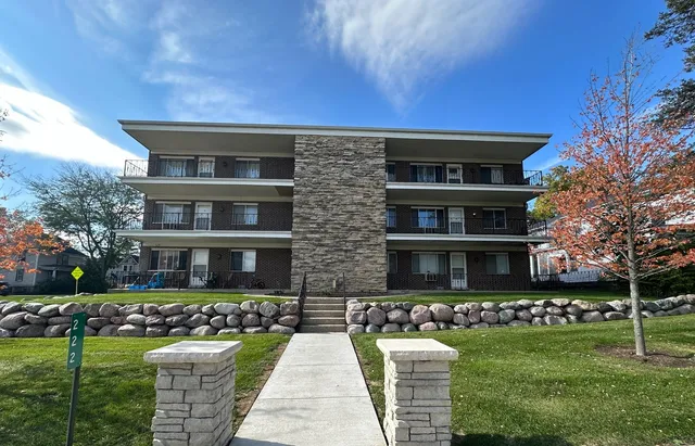 a front view of building with yard