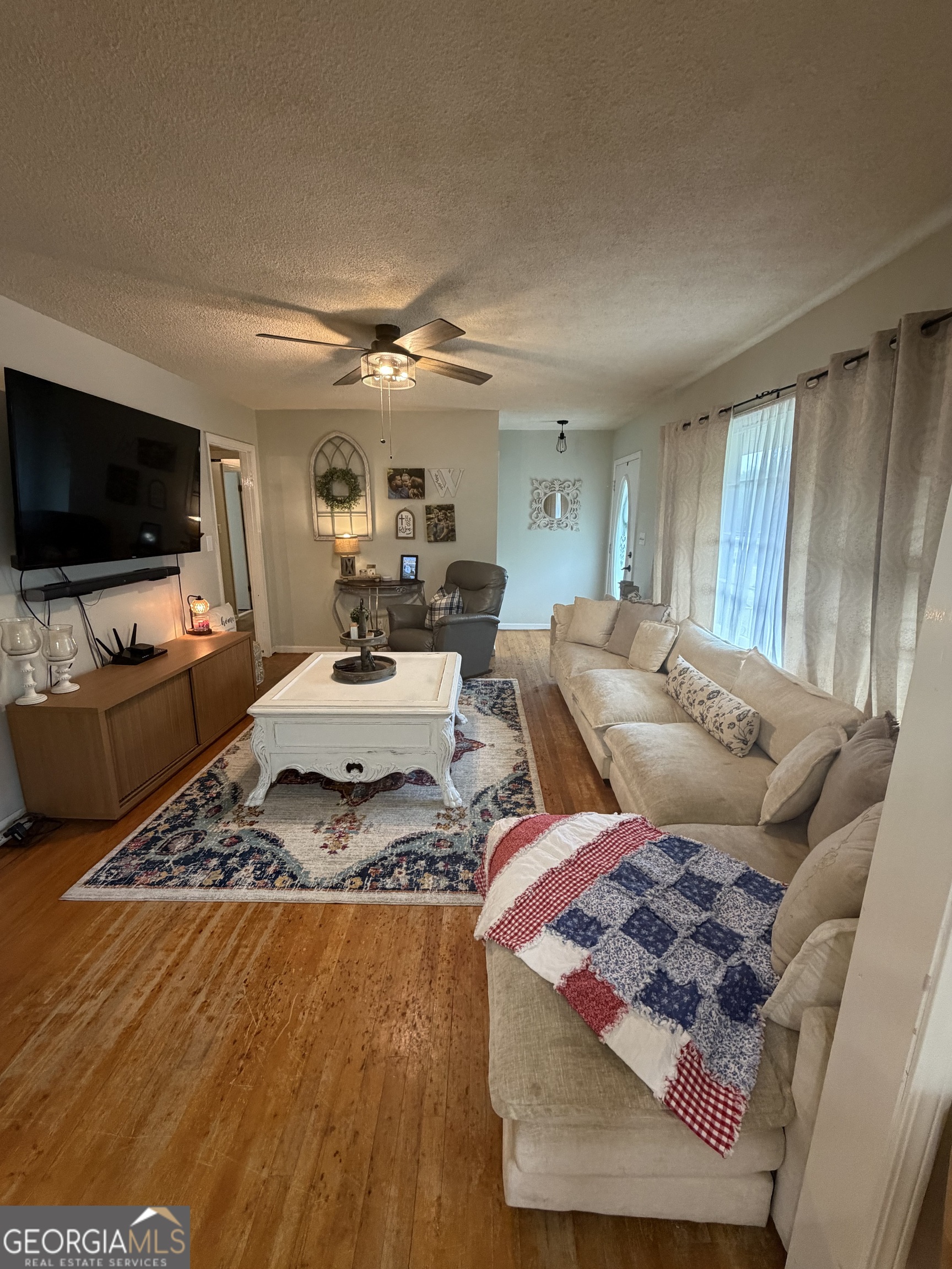 410 Ridgecrest Drive Elberton, GA 30635 - Photo 11 of 29 a living room with furniture and a flat screen tv