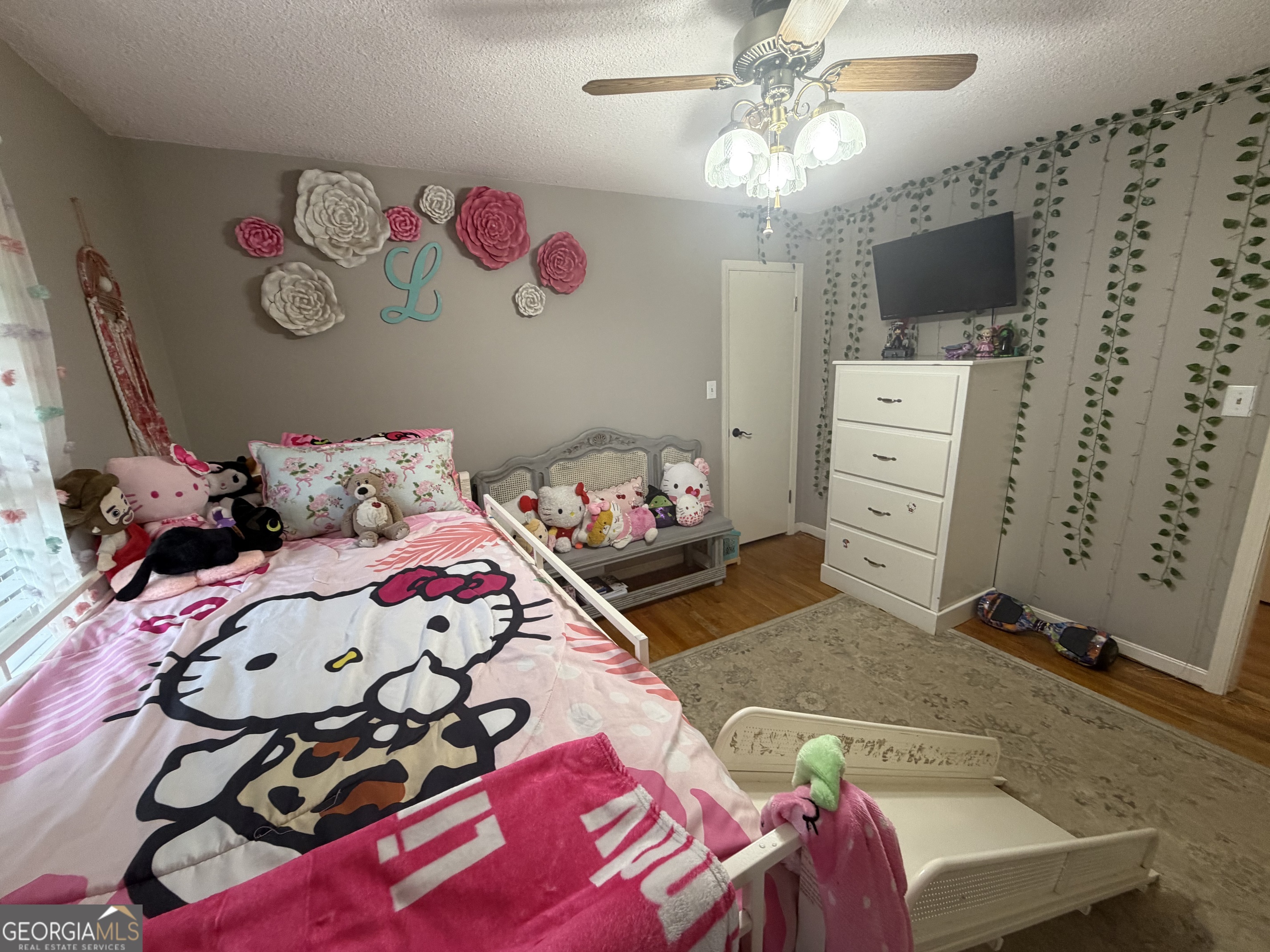 410 Ridgecrest Drive Elberton, GA 30635 - Photo 16 of 29 a bedroom with a bed and a chandelier