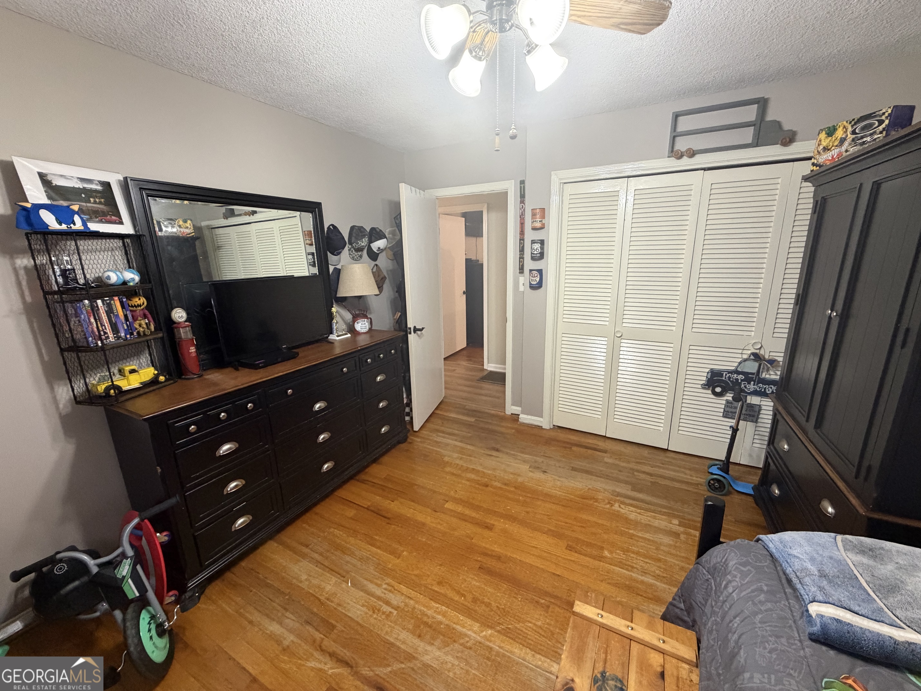 410 Ridgecrest Drive Elberton, GA 30635 - Photo 18 of 29 a bedroom with a bed and a flat screen tv