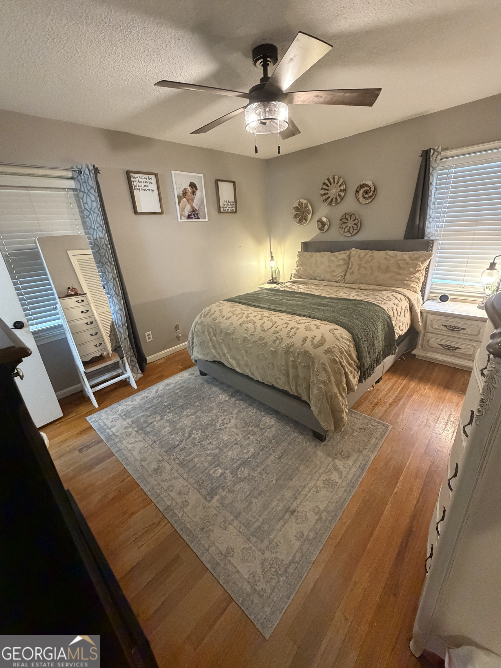 410 Ridgecrest Drive Elberton, GA 30635 - Photo 20 of 29 a bedroom with a bed and a flat tv screen on dresser