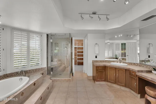a view of a patio with chairs and plants