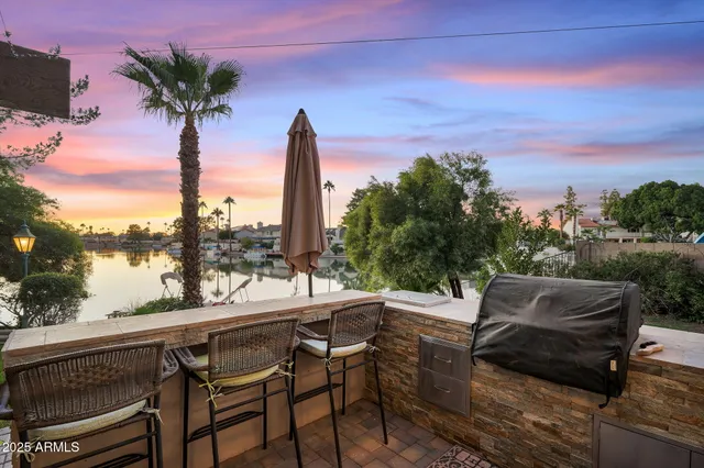 a living room with furniture fireplace and a large window
