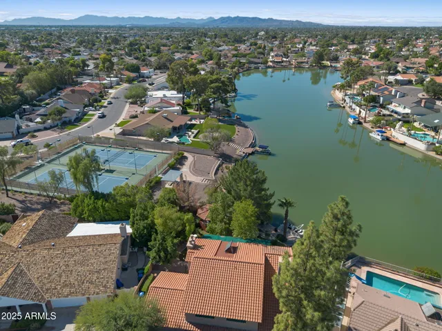 a large kitchen with stainless steel appliances granite countertop a stove a sink and a granite counter tops