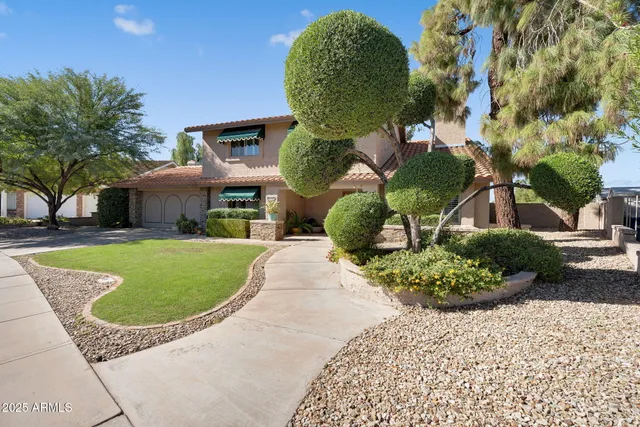 a kitchen with granite countertop a stove and a sink