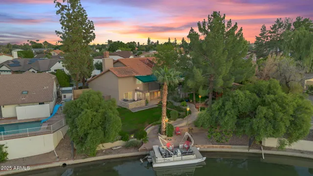 a view of a house with a yard and plants