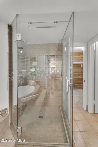 a white bench sitting in the middle of a building