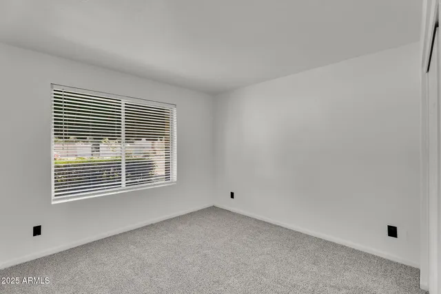 an aerial view of residential houses with outdoor space and river