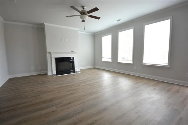 a kitchen with kitchen island granite countertop a sink a counter top space stainless steel appliances and cabinets