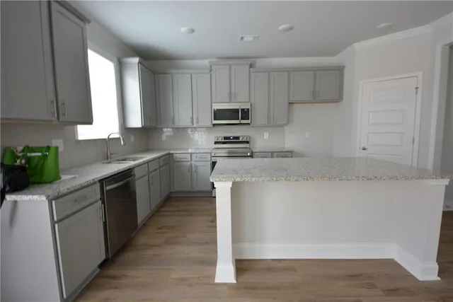 a bathroom with a sink toilet and mirror