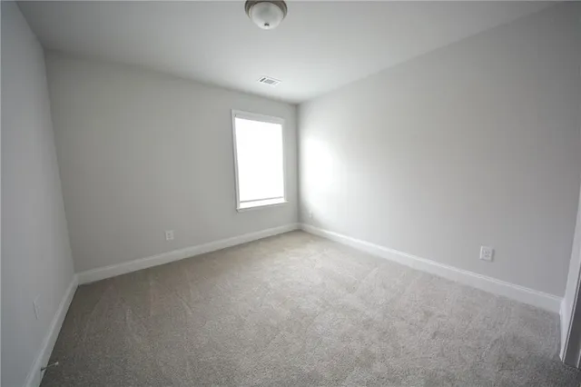 a bathroom with a granite countertop bathtub and sink