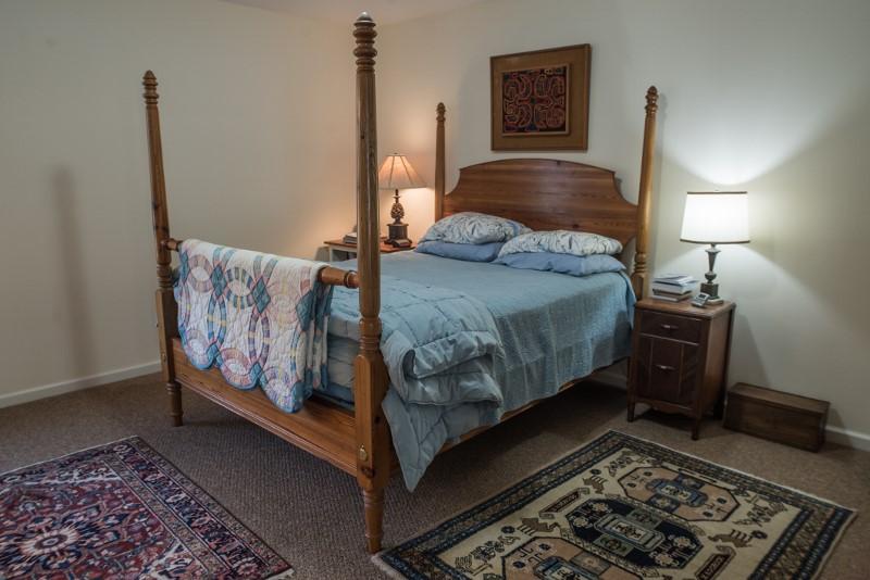 923 Long Level Road Southwest Floyd, VA 24091 - Photo 14 of 33 a bedroom with a bed and wooden floor