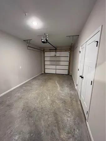 a view of room with stairs and a rug