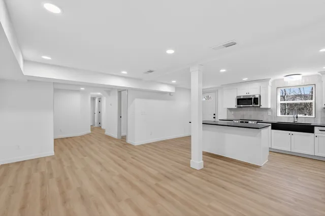 a view of kitchen with microwave and stove