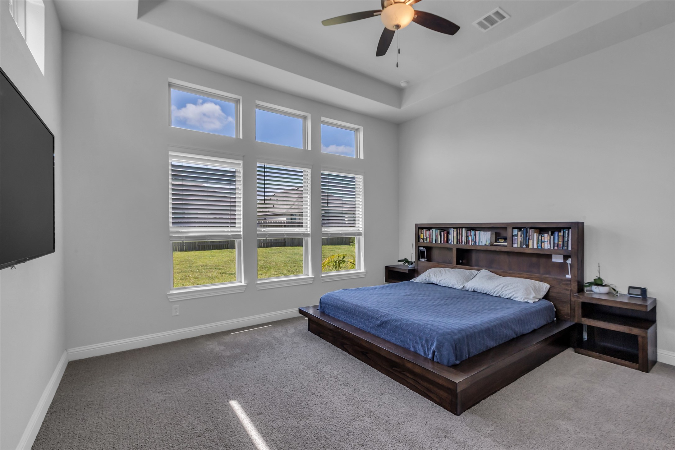 423 Round Top Street Webster, TX 77598 - Photo 22 of 49 Picture windows let the light in and you can see the stars at night from your bed!
