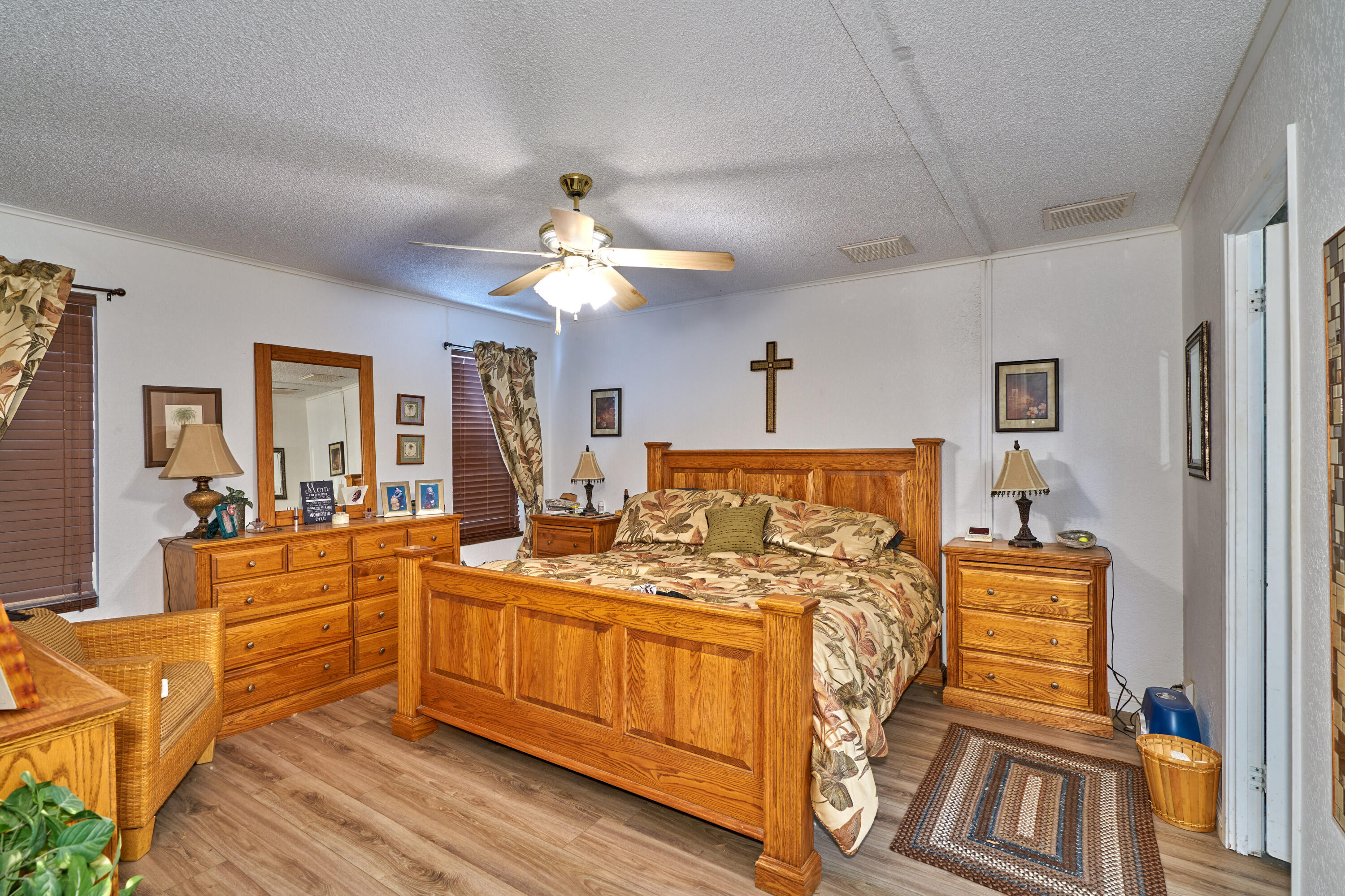 33537 Lisa Circle Thousand Palms, CA 92276 - Photo 13 of 35 a bed room with a bed and a chandelier